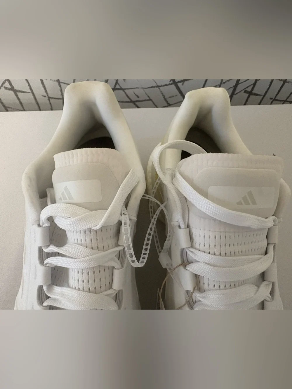 adidas Avaluxe tennis shoes in white with subtle pastel yellow accents. JQ7080